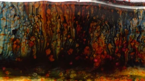 Many red crystals dissolve in dirty water Video stock 158241624