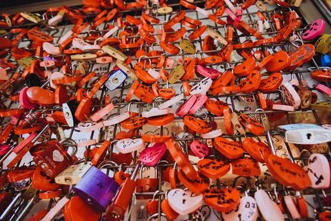 Many red locks in the form of hearts with the names of lovers. Near Juliet's  Stock Photos
