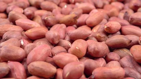 Many of red peanuts in a table Stock Photos