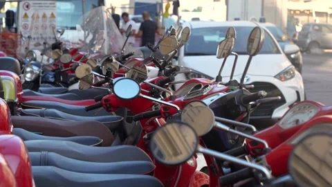Many red scooters close up stand on one of the streets of Rome. Stock Footage 287963126