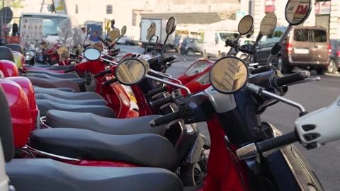 Many red scooters close up stand on one of the streets of Rome. Stock Footage 287963186