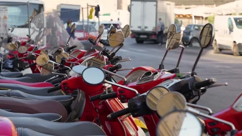 Many red scooters close up stand on one of the streets of Rome. Stock Footage 287963267