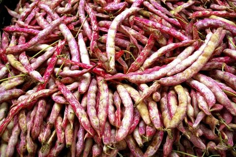 Many red string beans on a market stall Stock Photos