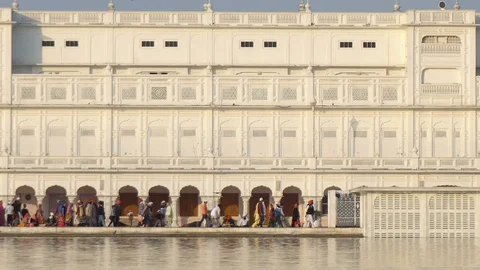 Many Religious Pilgrims of Sikhism Religion at The Golden Temple Harmandir Sahib Stock Footage