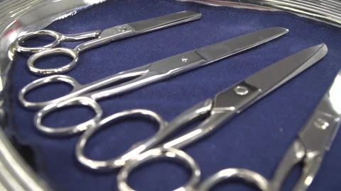 Many  ribbon scissors on the plate. Stock Footage 132428521