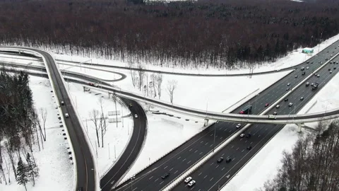 Many road junctions in the forest belt. Cars move in different directions on the Stock Footage 155466518