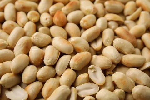 Many roasted peanuts as background, closeup view Stock Photos
