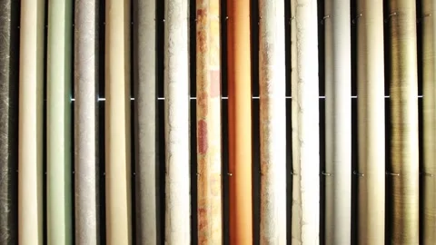 Many rolls of wallpaper with different colors are sold in the store, a large Stock Footage 254060627