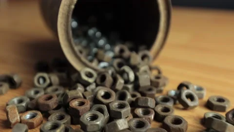 Many rusty elements. Old rusty nut. Dirty metal nuts are scattered on the table Stock Footage 232538217