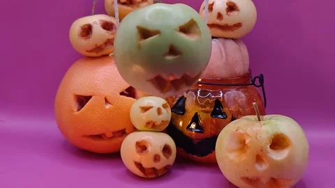 Many scary pumpkins on a purple background. 動画素材 344455169