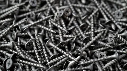 Many self tapping screws background Stock Photos