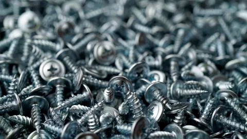 Many self tapping screws background Stock Photos