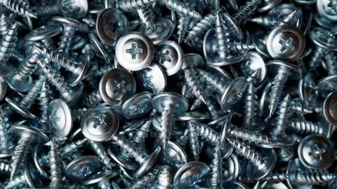 Many self tapping screws background Stock Photos