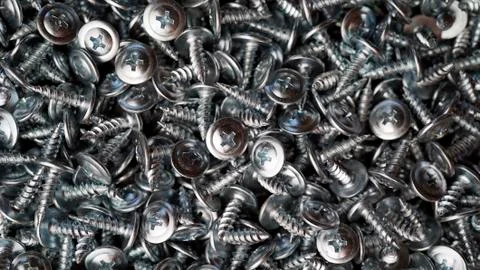 Many self tapping screws background Stock Photos