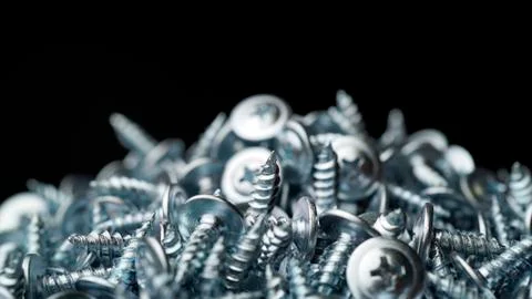 Many self tapping screws background Stock Photos