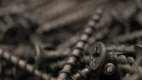 Many self tapping screws rotate motion background. Working tools close up. Vídeos de archivo 94431712