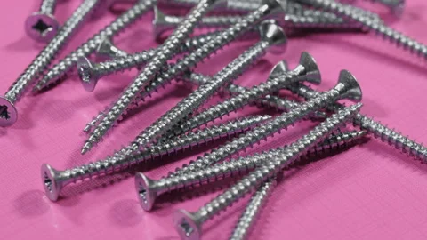 Many self tapping screws rotate motion background. Working tools close up. Stock Footage 99834687