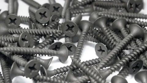 Many self tapping screws rotate motion background. Stock Footage 109036554