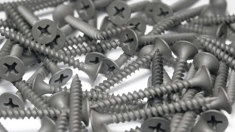 Many self tapping screws rotate motion background. Stock Footage 109036589