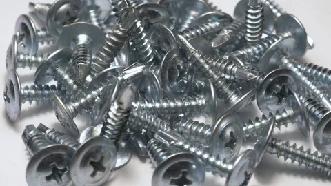 Many self tapping screws rotate motion background. Stock Footage 109036657