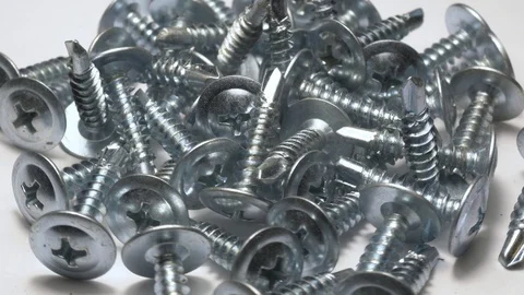 Many self tapping screws rotate motion background. Stock Footage 109036690