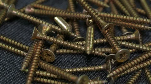 Many Self Tapping Screws Rotate Motion Background. Working Tools Close Up. Video stock 243934361