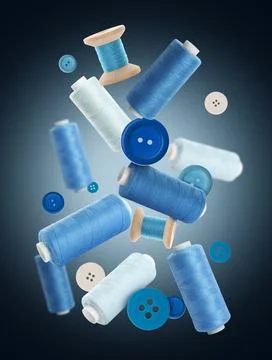 Many sewing threads in different shades of blue flying on dark gradient bac.. Stock Photos