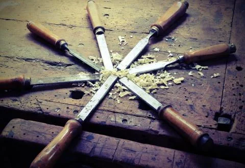 Many sharp chisels with sawdust and vintage effect Stock Photos