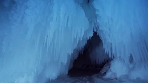 Many sharp icicles winter frozen grotto cave, arctic Antarctica glaciers Baikal  Stock Footage 165664077