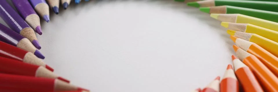 Many sharp multicolored sharp pencils lying in shape of circle closeup Stock Photos