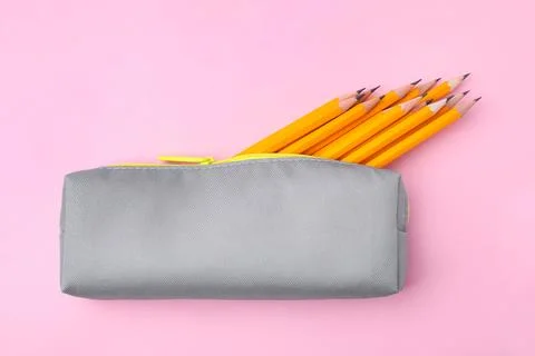 Many sharp pencils in pencil case on pink background, top view Stock Photos