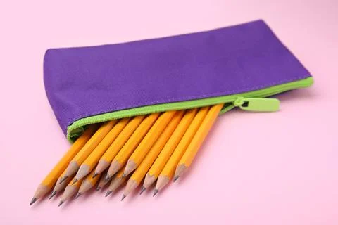 Many sharp pencils in pencil case on pink background 写真素材
