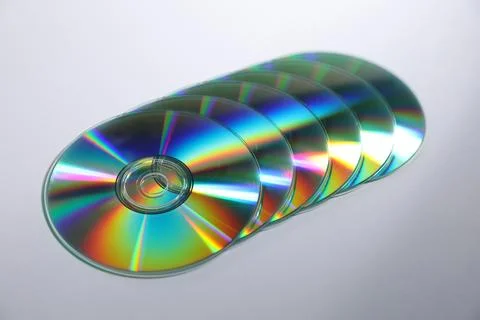 Many shiny compact discs on light background Stock Photos