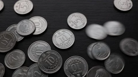 Many silver Ukrainian coins, close-up of metal money on a brown background Stock Footage 219329331