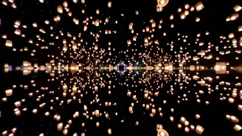 Many Sky Lanterns Floating Around To Night Sky and Reflection Effect Stock Footage 141073574