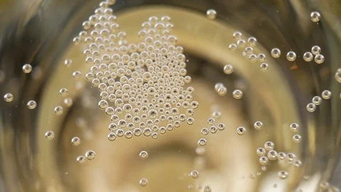 Many small champagne bubbles in a glass of champagne Stock Footage 107969887