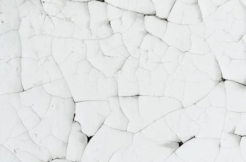 Many small cracks on the yellowed surface. Very old faded white paint, vintag Stock Photos