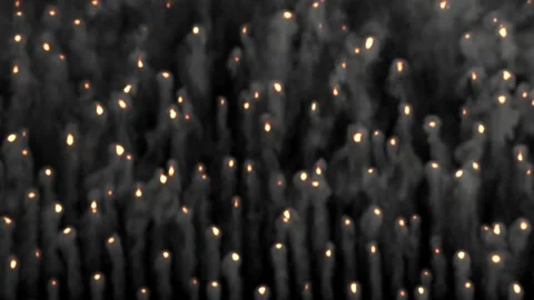Many small flames rise up, leaving tails of gray smoke behind them. Stock Footage 170639470