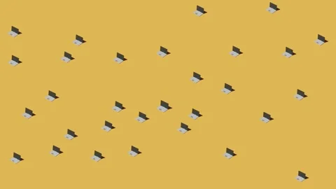 Many small laptops computers change position on yellow background floor and  Stock Footage 248622973