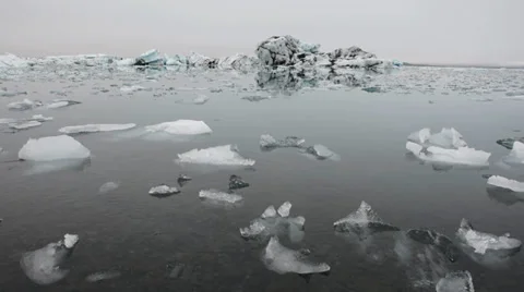 Many small peaces of ice slowly floating in the Glacier lagoon, Iceland Stock Footage 33778520