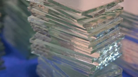 Many small pieces of hardened sheets clear glass, cut to size as factory product Stock Footage 111647643