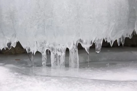 Many small thin icicle with tiny drip Stock Photos