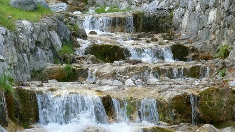 Many small waterfalls in the mountains Video stock 97928670