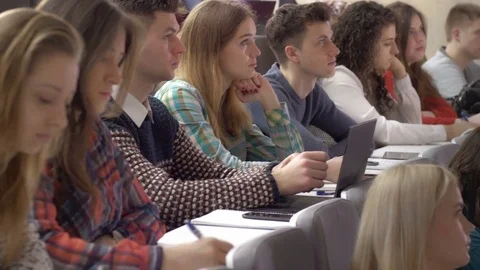 Many smart students during the university presentation in the lecture hall Stock Footage 69907591
