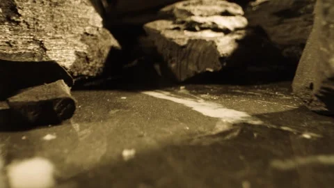 Many smoking black coals lying on a marble textured table . Ash on marble stone Stock Footage 314046209