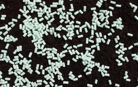 Many snail pellets on the soil Stock Photos
