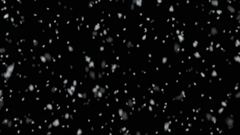 Many snow flakes drifting down slowly on a black background. Digital animation. Video stock 144754041