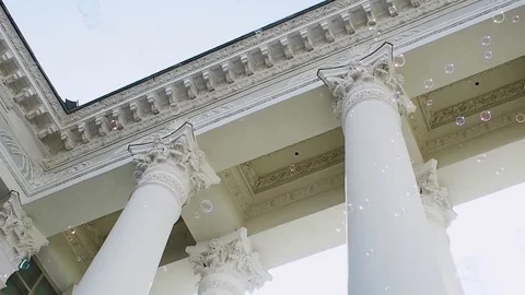 Many soap bubbles fly on the background of the classical portico with columns, Видео 121830400