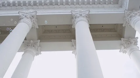 Many soap bubbles fly on the background of the classical portico with columns, Видео 121841779