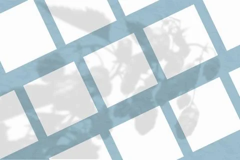 Many square sheets of white textured paper against a blue wall. Mockup overlay Stock Illustration